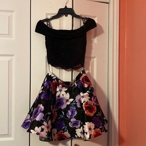Two-piece dress with black off the shoulder top and floral, rumpled skirt